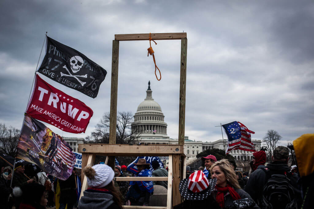 Supporters of President Donald Trump surround the U.S. Capitol following a riot on January 6, 2021 in Washington, DC. (Photo by Samuel Corum/Getty Images)