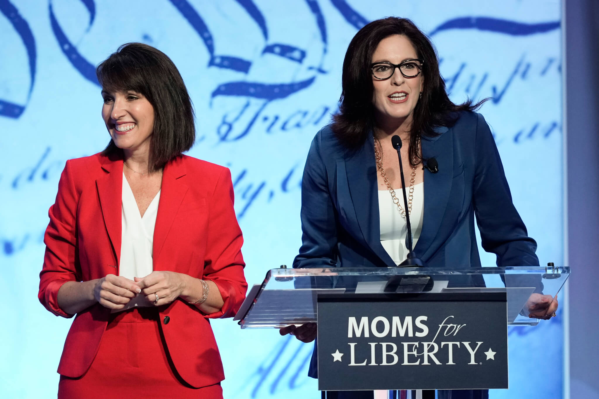 Moms for Liberty co-founders Tina Descovich, left, and Tiffany Justice, speak at the Moms for Liberty meeting in Philadelphia, Friday, June 30, 2023. (AP Photo/Matt Rourke, File)