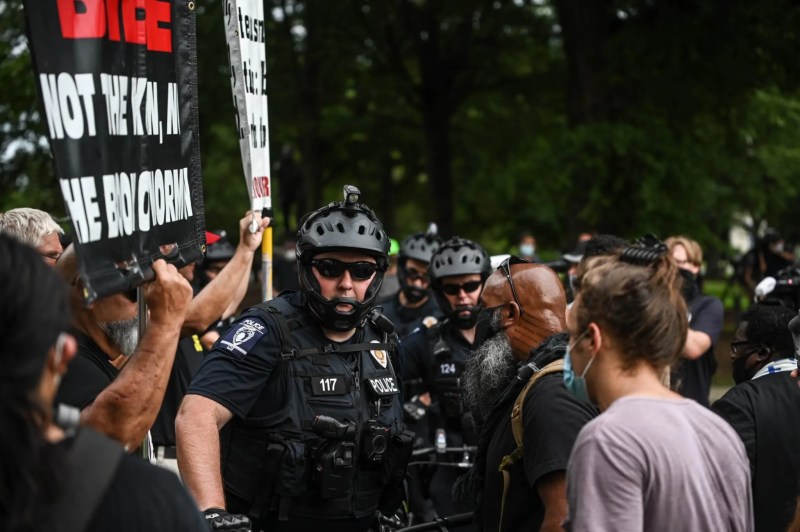 Anti-Trump protesters clashed with counterprotesters and police outside of the Republican National Convention Monday in Charlotte. Our reporter witnessed police using their bikes as weapons against demonstrators and pepper spraying one young man. (Image for Cardinal & Pine by Alvin Jacobs Jr.)