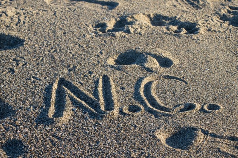 N.C. written in the sand on a North Carolina beach