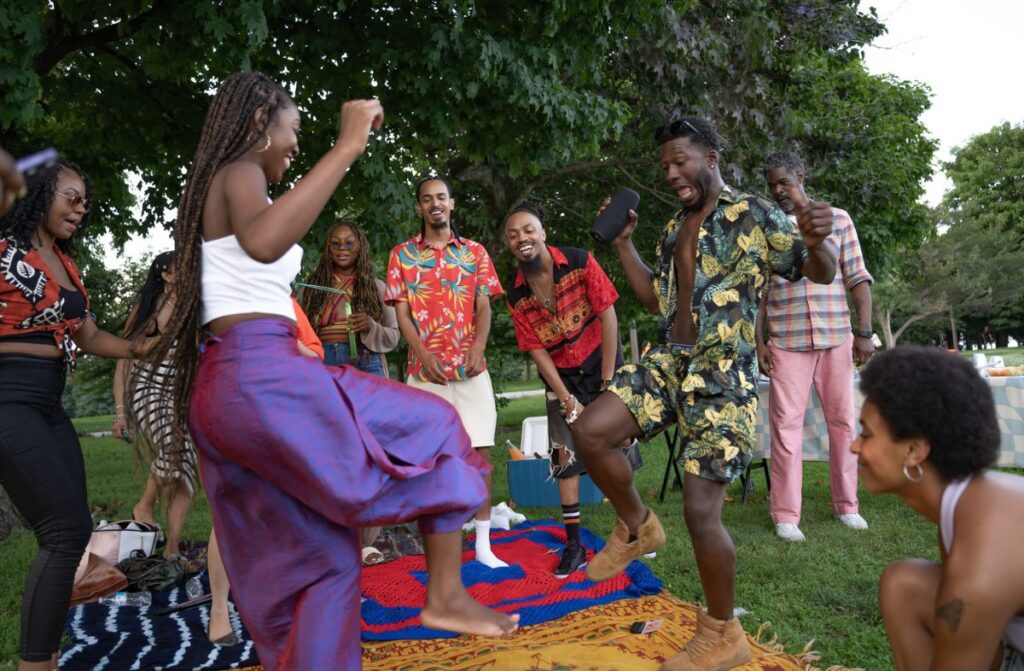 Black family celebrating Juneteenth in a park.