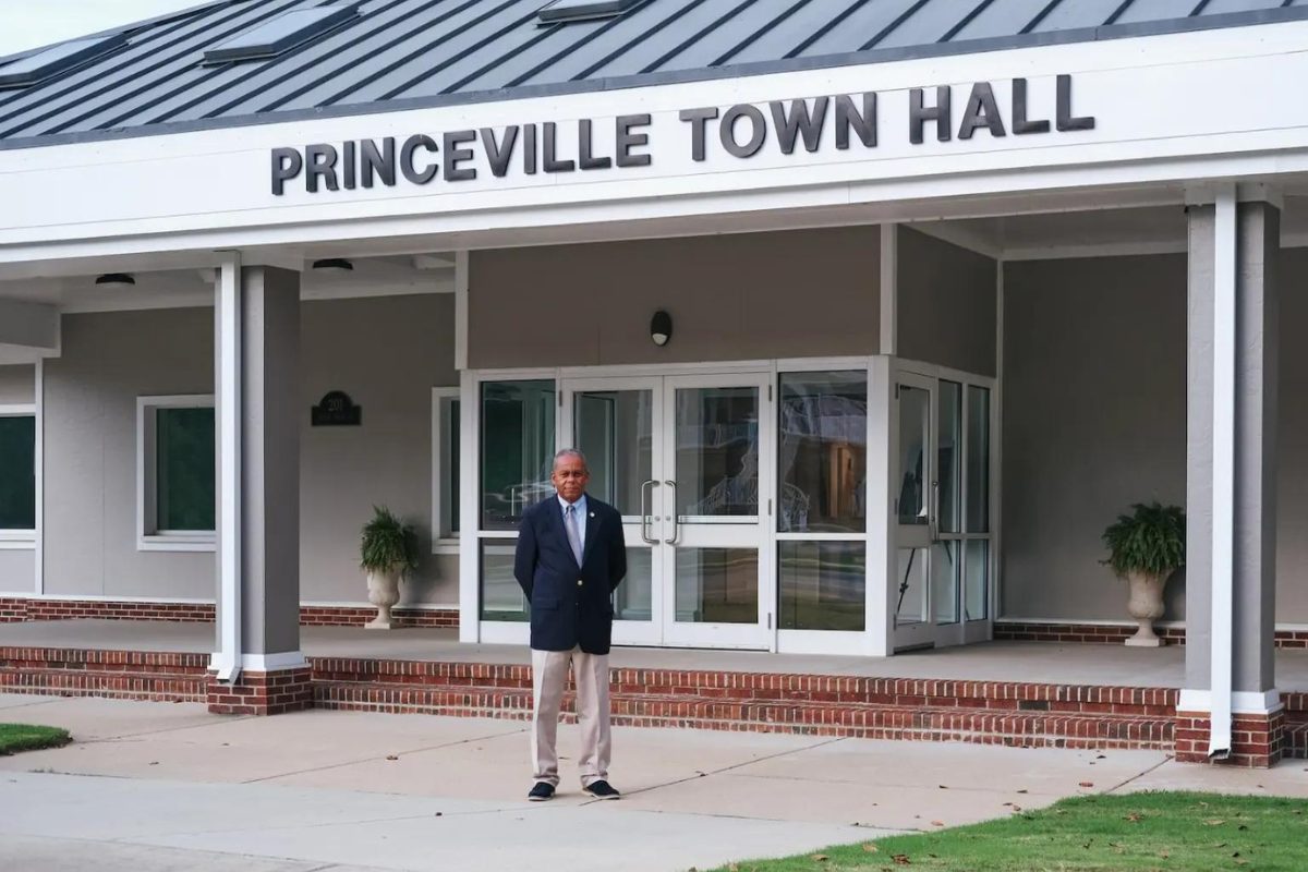 Mayor Bobbie Jones stands in front of Princeville’s rebuilt town hall in 2022. Grist / Gabrielle Joseph