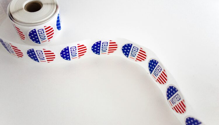 Roll "Voted" stickers against white background.