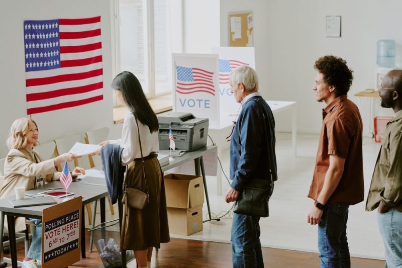 A line of people waiting to check-in to vote