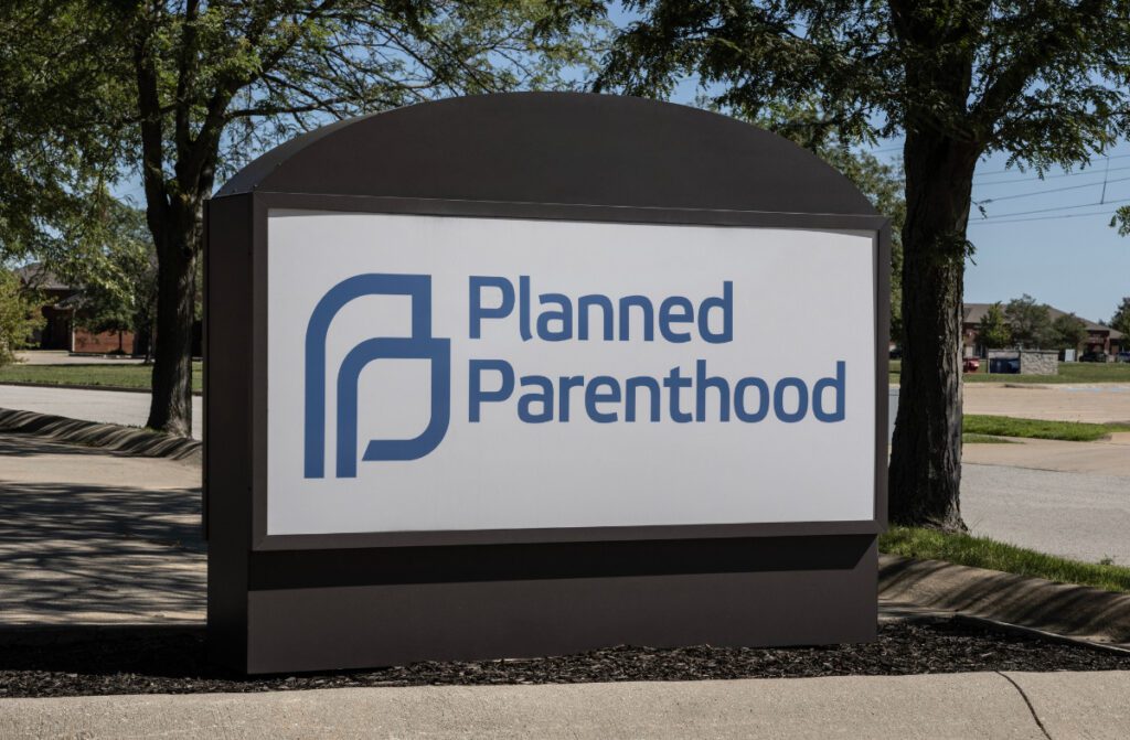 White Planned Parenthood sign with blue lettering.