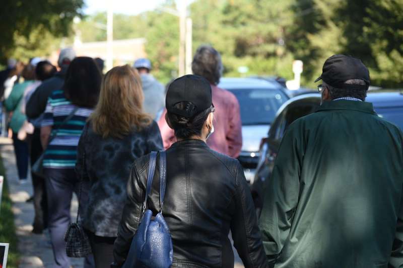 Group of people walking away from camera