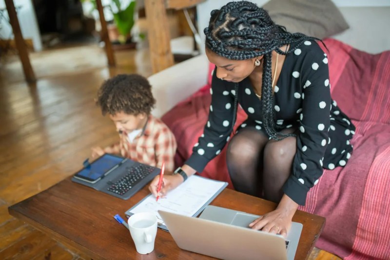 Mother and child sitting at table together