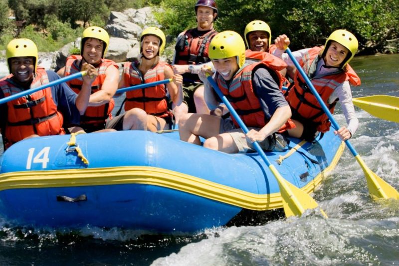 people smiling while rafting