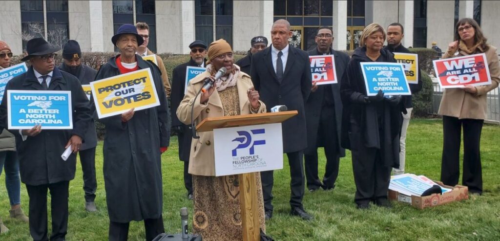 Photo of teachers , social workers, and advocates gathered at the NC General Assembly to talk about the issues involving the Assembly failing on the state budgets.