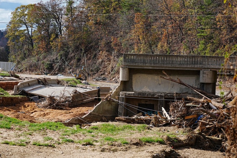 A part of the bridge that collapsed lies near the rest of the bridge that connected vehicles from Azalea Road to Asheville Recreation Park.