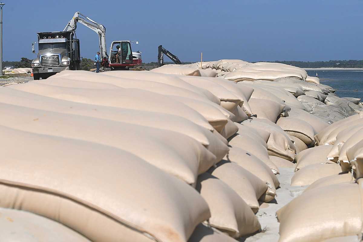 Layers of sandbags have been placed along the east end of Ocean Isle Beach to protect recently built homes