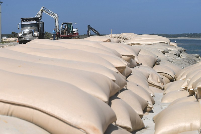 Layers of sandbags have been placed along the east end of Ocean Isle Beach to protect recently built homes
